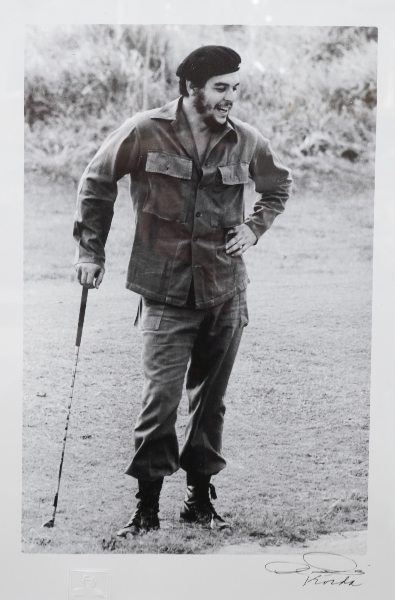 After Alberto Korda (1928-2001), ‘Che Guevara Golfing’, stamped, facsimile signature, gelatin silver print, 39 x 26cm